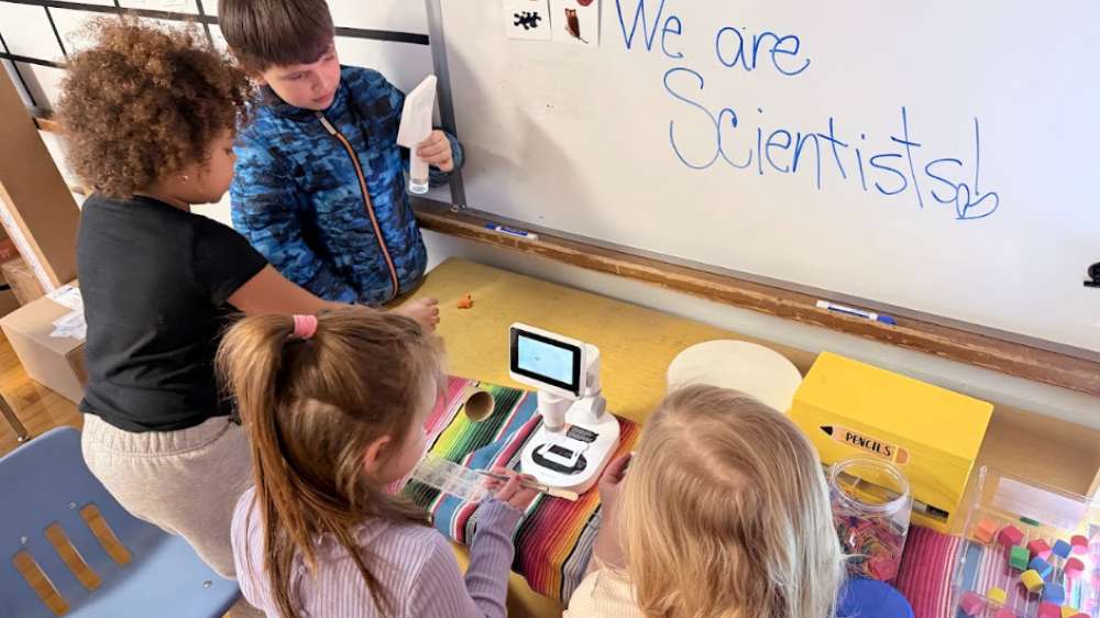 KEF Students Around Whiteboard