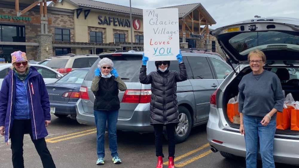 20220517 My Glacier Village ladies holding sings